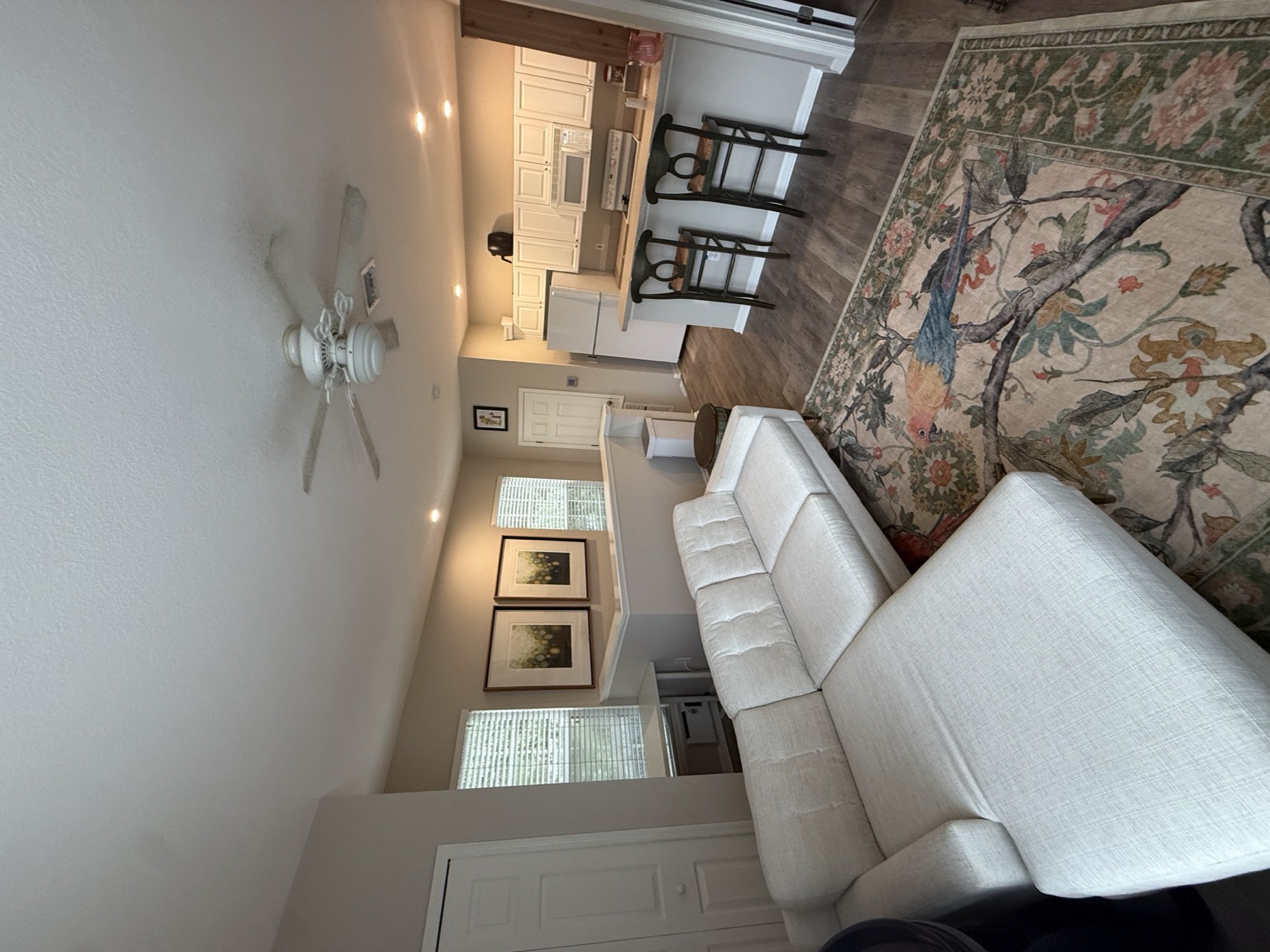 Living room with a sectional sofa, open to the kitchen